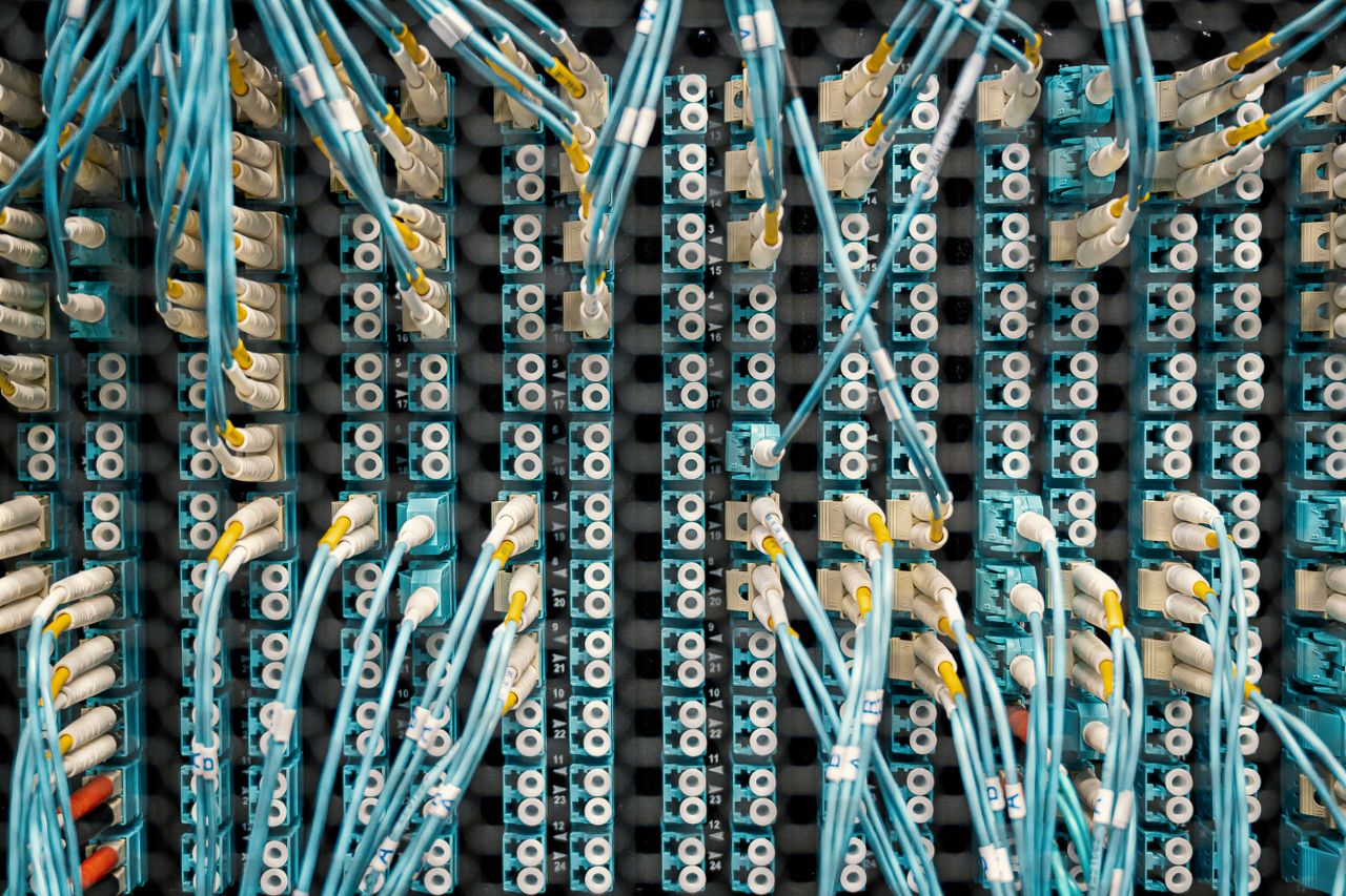 Crafting Captivating Headlines: Your awesome post title goes here Top view of fiber optic cables connected to ports in modern data server